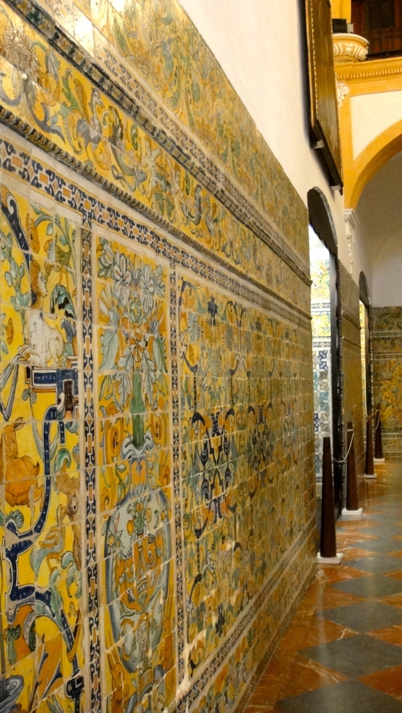 A long wall of Gothic Christian tiles. These feature more humans and anthropomorphic animals, whereas Muslim tiles tend to focus on the use of geometric shapes.